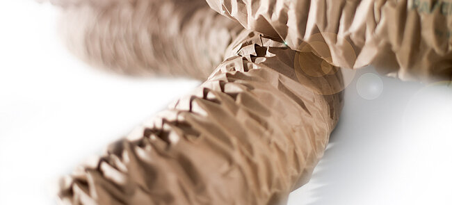 
			A brown paper cushioning strip